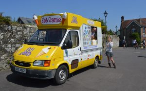 One of Fat Sam's Ice Cream van serving a customer at Park Walk in Shaftesbury, Dorset